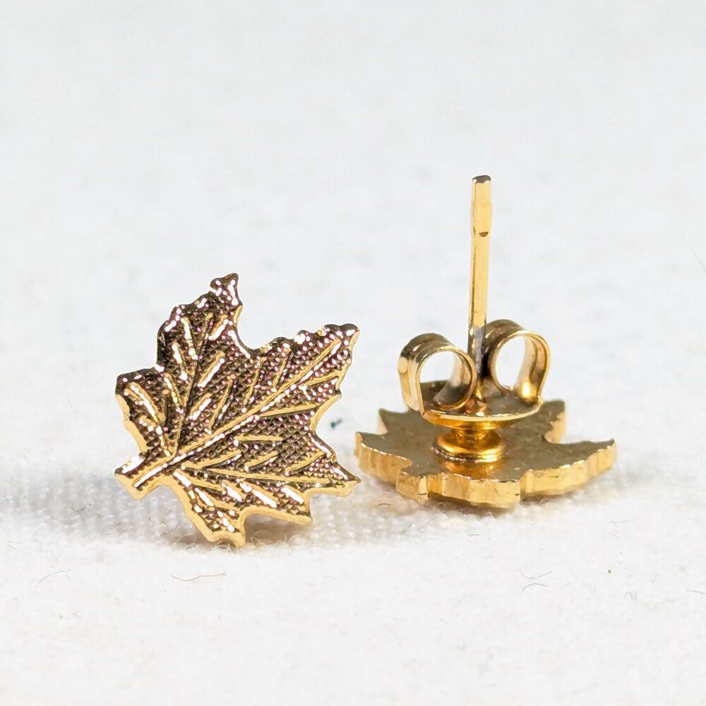 Gold toned metal Maple Leaf stud earrings